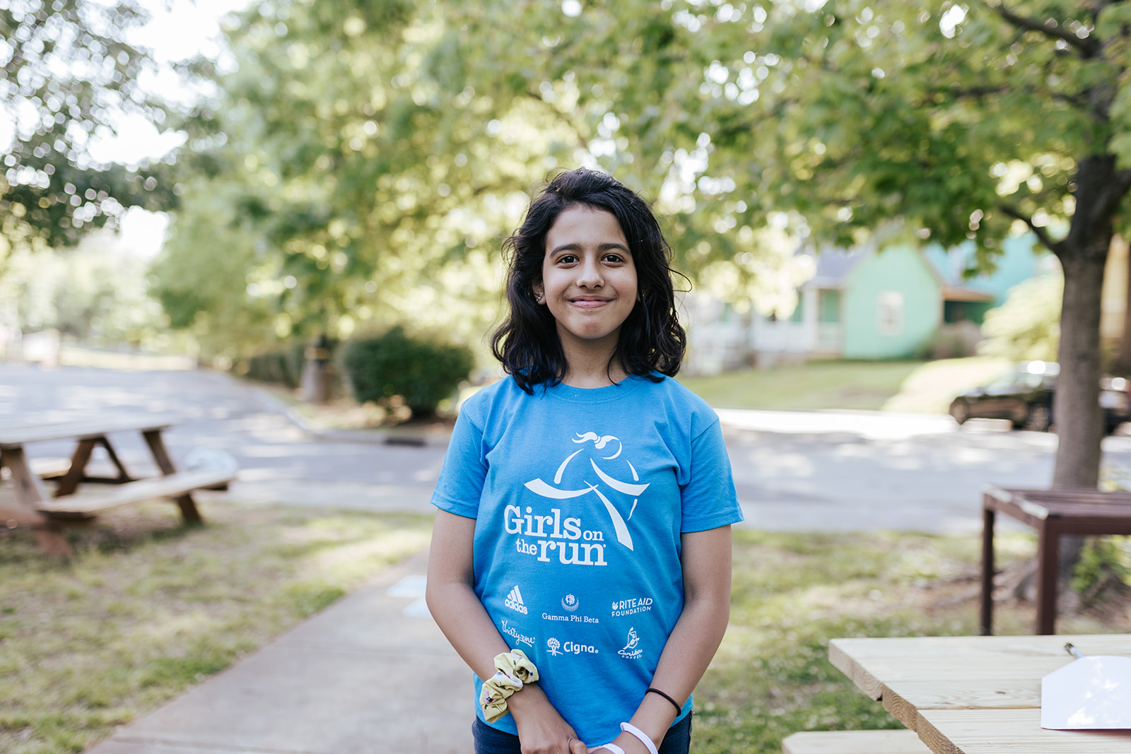Girls on the Run participant smiles outdoors 